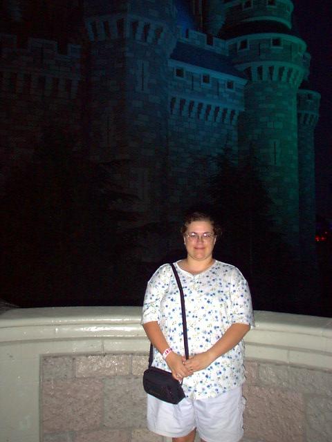 (3-11-02 - Magic Kingdom) Ander in front of the castle at night