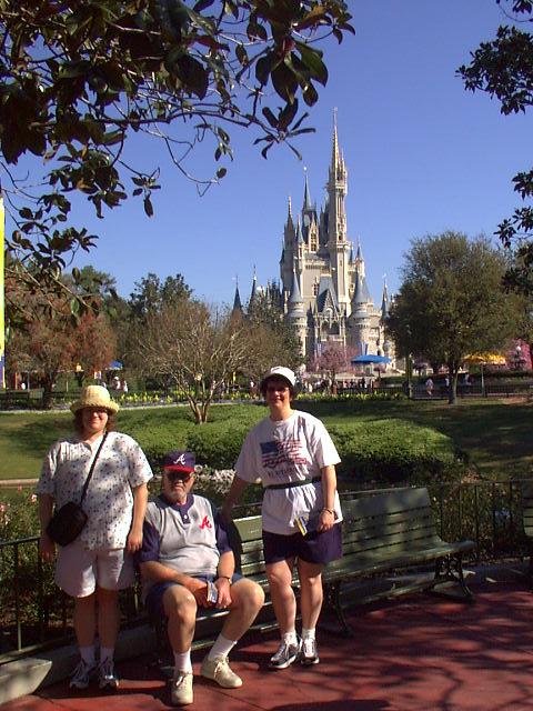 (3-11-02 - Magic Kingdom) Ander, dad, & Jill in front of castle